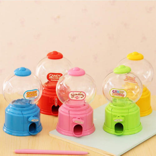 Cute tabletop candy machine with twist knob and clear dome.