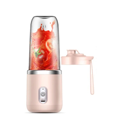 Portable blender with a pink base and clear container filled with a red smoothie on a white background